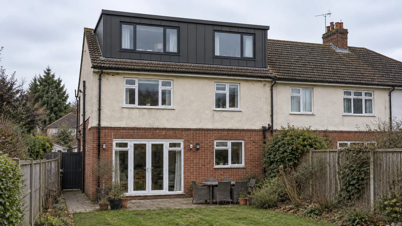 Sutton Coldfield semi-detached house with a proposed full-width graphite-clad rear dormer and two broad dark-framed windows