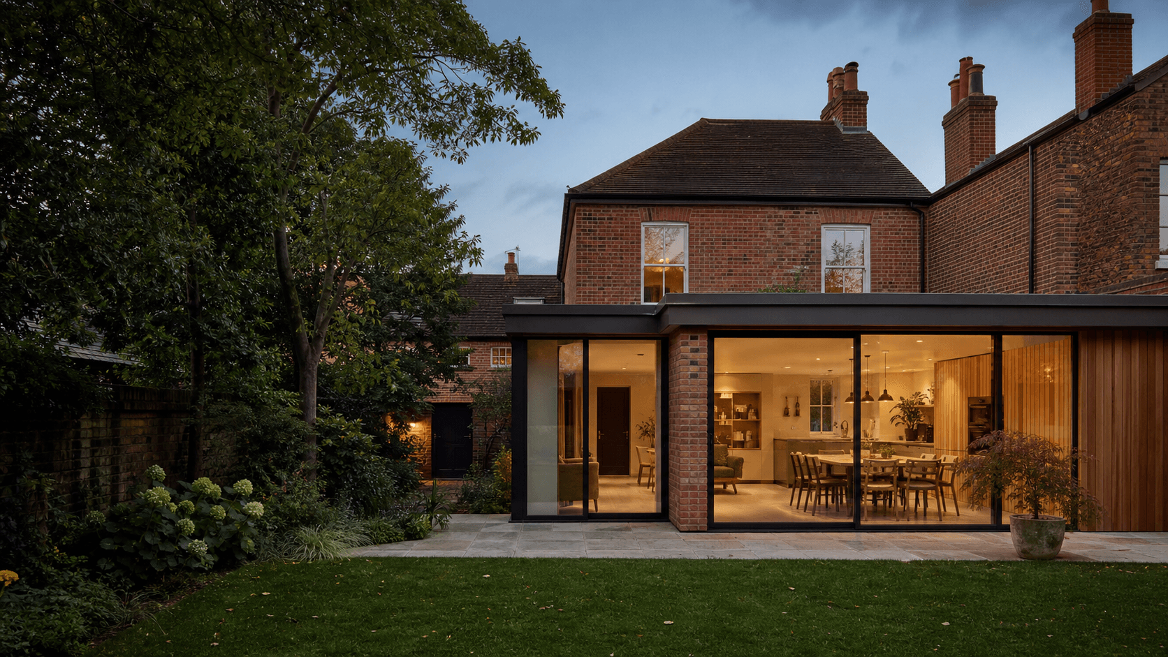 Modern residential extension with large glazing and landscaped garden